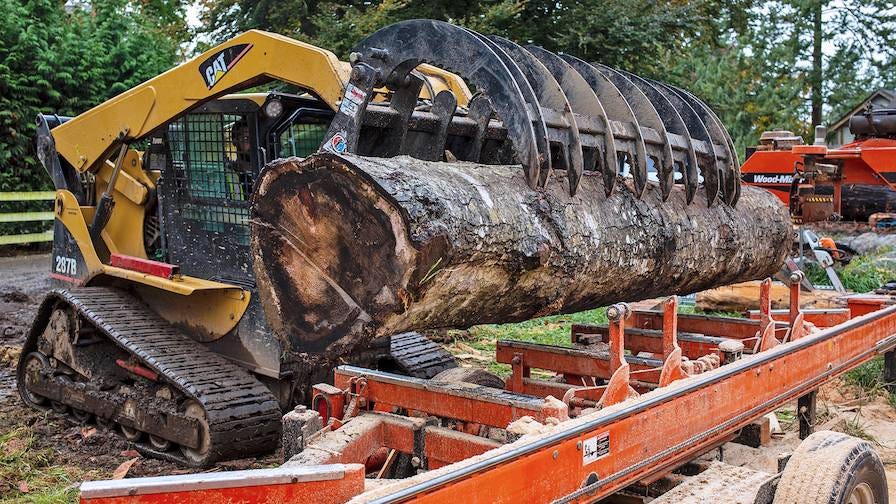 West Coast Custom Timber loading logs on the sawmill