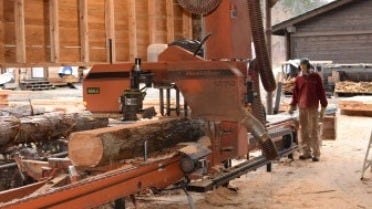 Harrop-Procter Community Co-op LT70 sawmill cutting