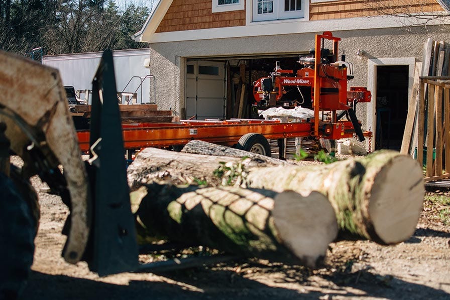 Loading logs on Wood-Mizer LT40 portable sawmill