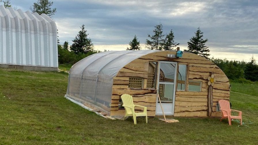 Side of unique wood greenhouse