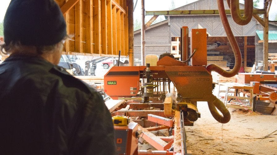 Operators view Wood-Mizer LT70 portable sawmill