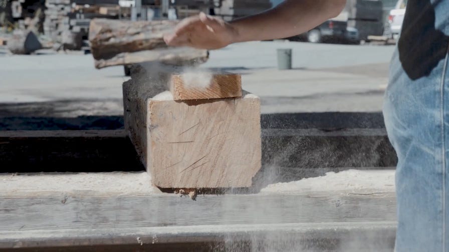 Stacked wood boards with sawdust